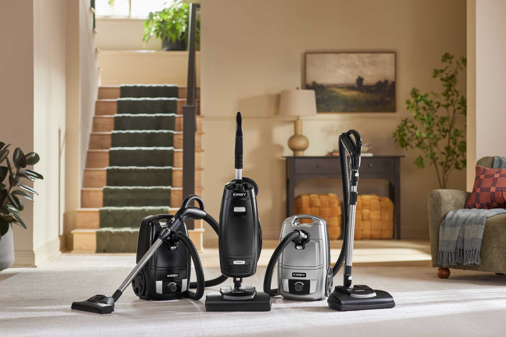 3 Kirby Signature Series vacuums in living room
