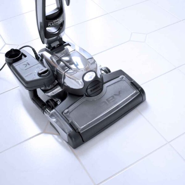 Kirby Avalir Platinum vacuum cleaner on a white tiled floor.